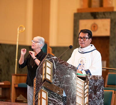 Fr. John Abulag with ASL interpreter