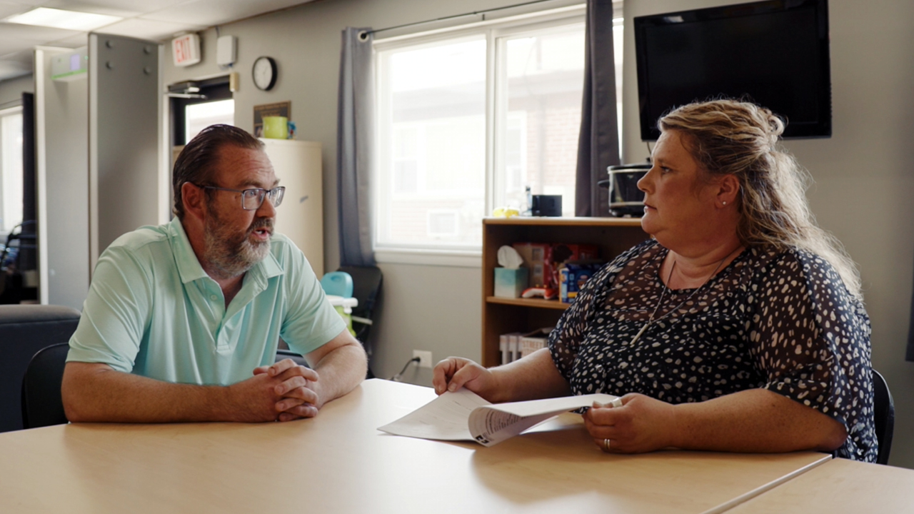 Image of Stephen talking to Kathy Paulsen about how Hope House helped him